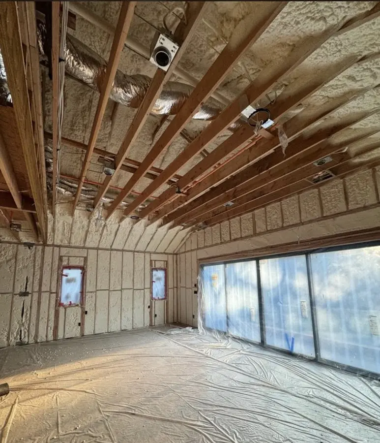 Interior walls and ceiling insulated with spray foam during new construction in Douglasville